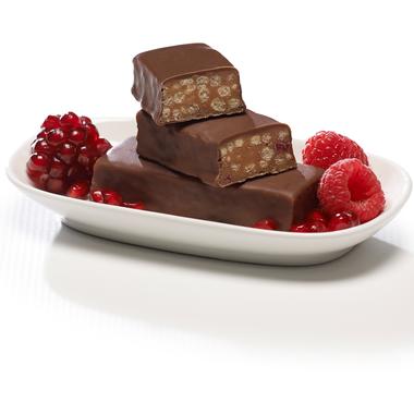 Raspberry pomegranate chocolate protein bars on white dish